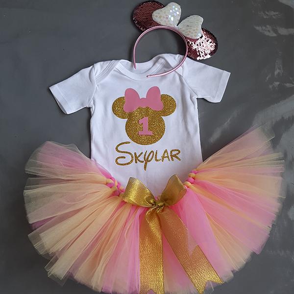 Gold glitter minnie mouse head top and a pink and soft yellow tut...