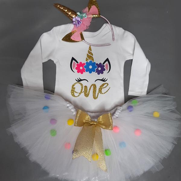 Product: White pom pom tutu set with a unicorn top and headband